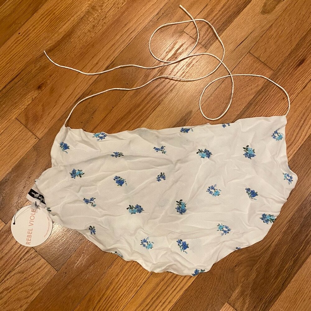White top with small blue flowers